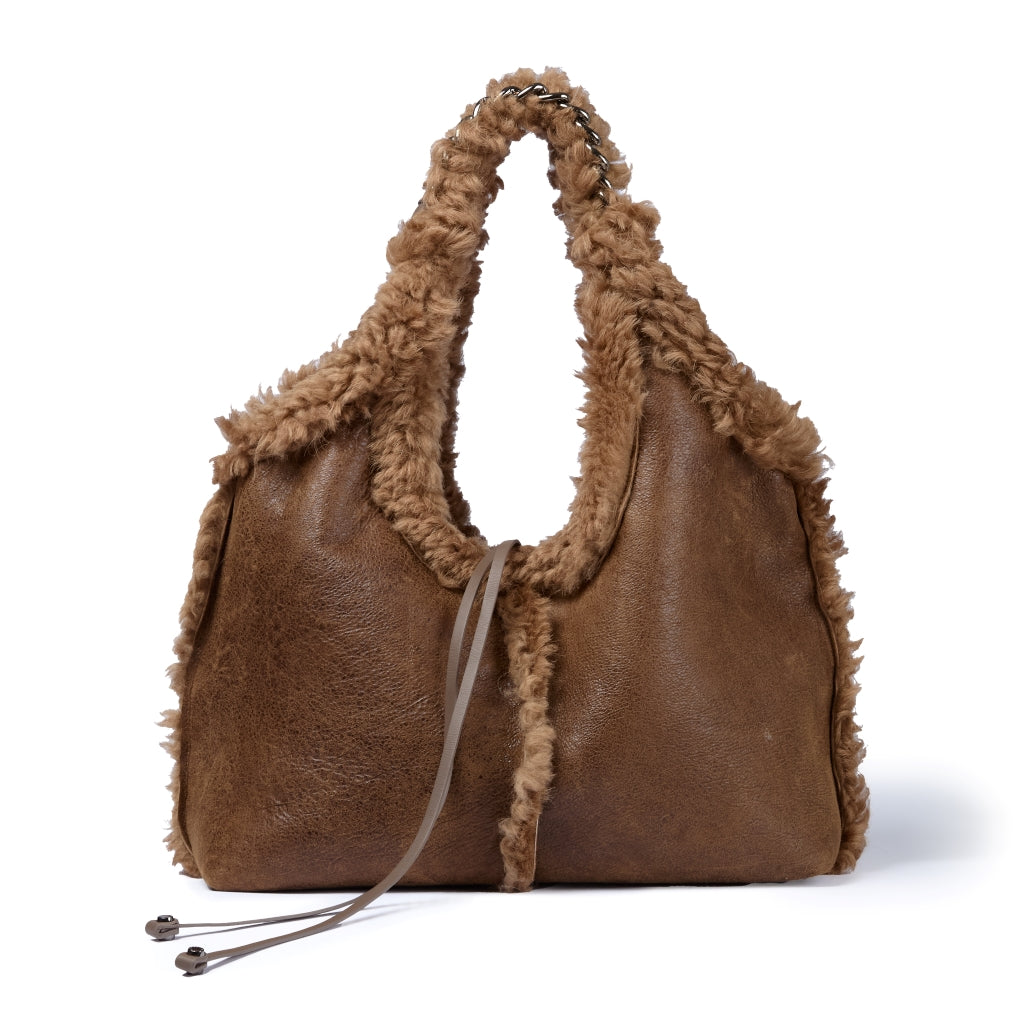 Grace woven elongated bag in braided calfskin