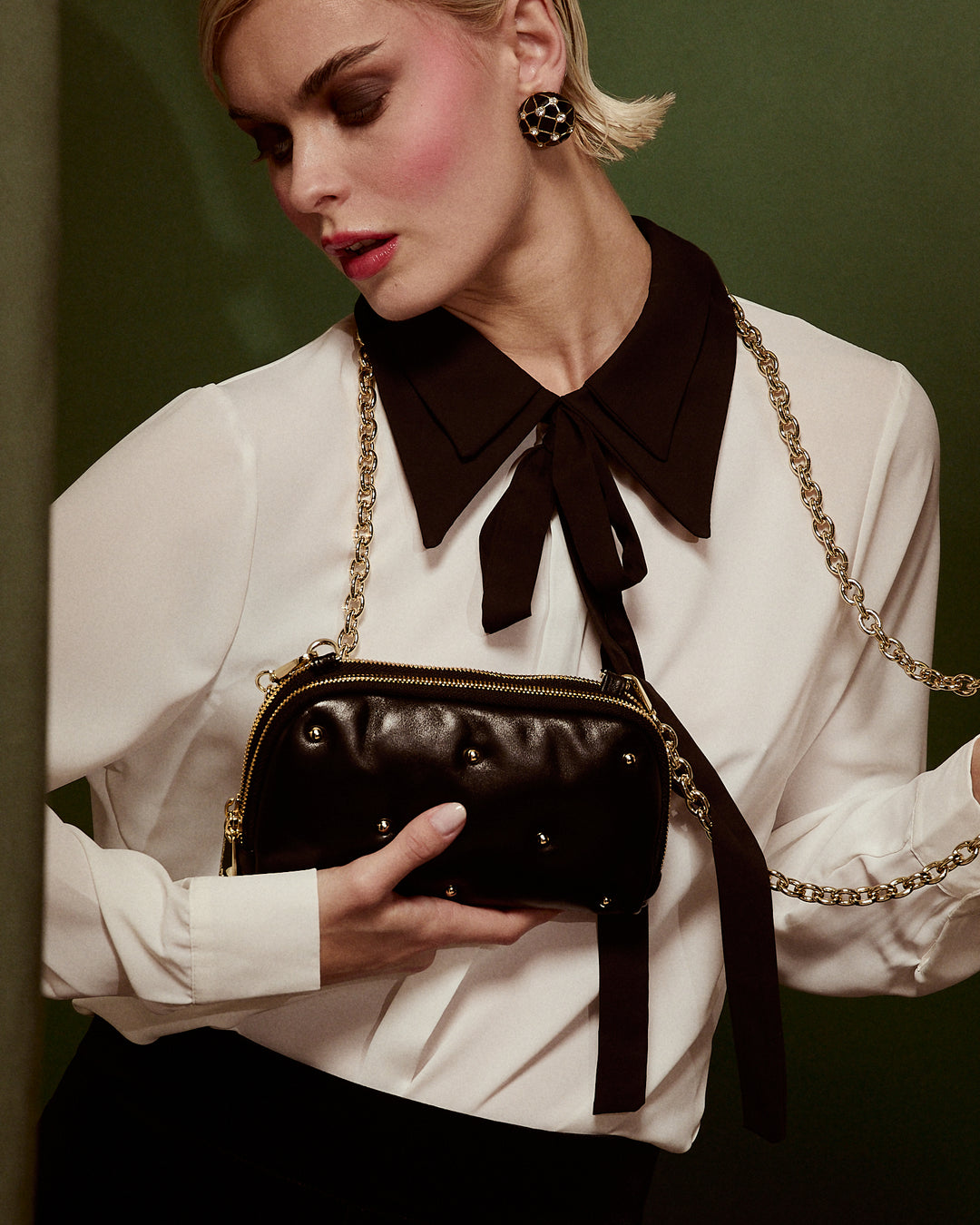 Marika purse in soft nappa with chain shoulder strap and leather sleeve