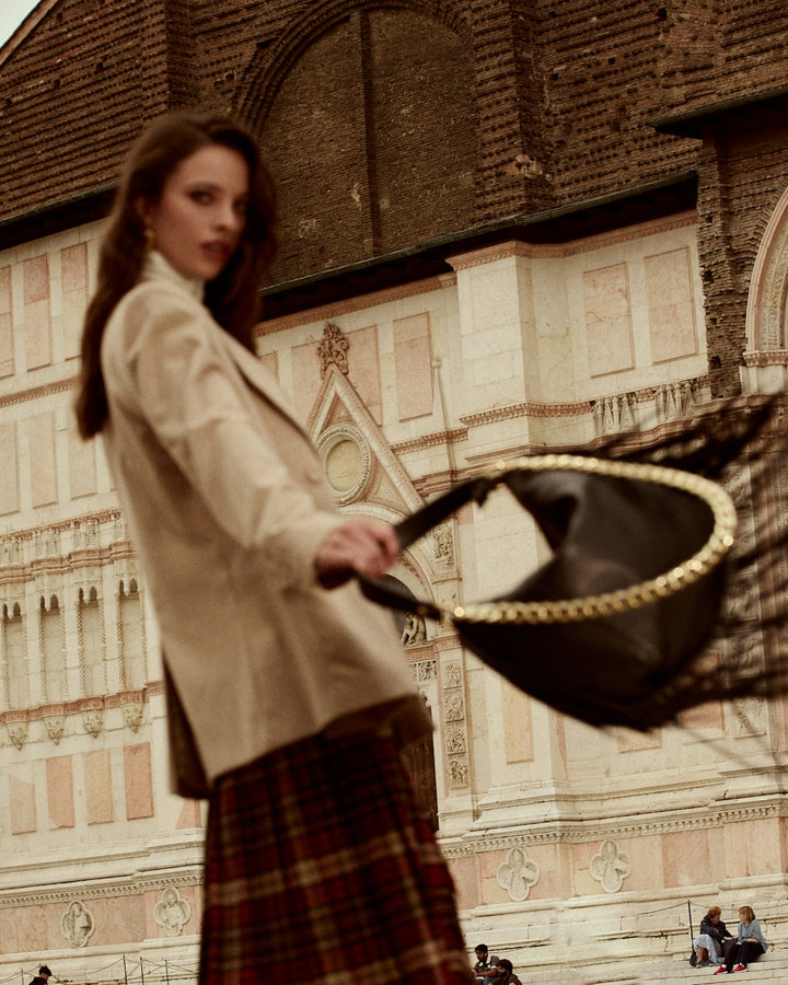 Amina small leather handbag with wrapped tubular handle and detachable shoulder strap