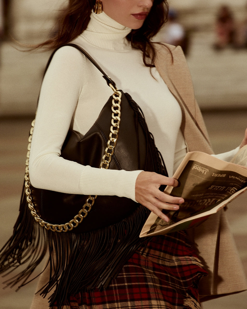 Amina small leather handbag with wrapped tubular handle and detachable shoulder strap