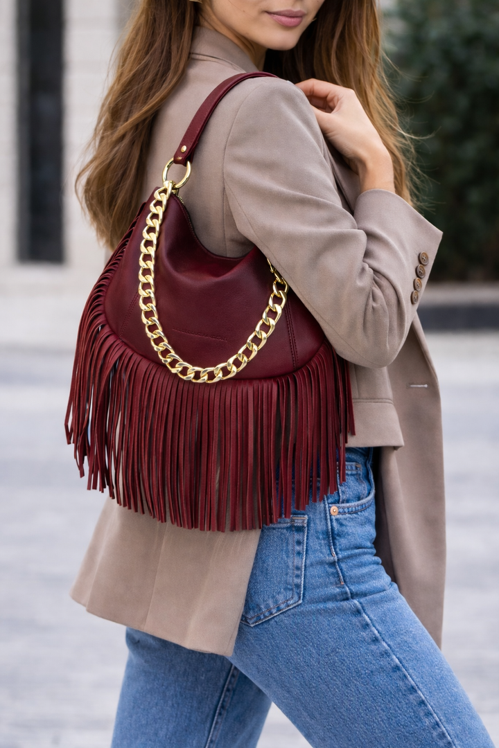 Amina small leather handbag with wrapped tubular handle and detachable shoulder strap