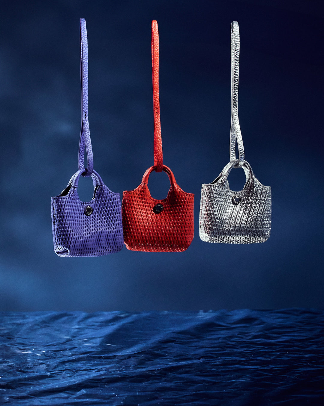 Porta air pods yuma charms in pelle stampa microforata con anella portachiavi
