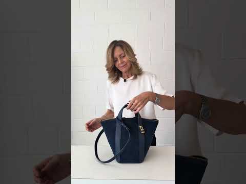 Amina small leather handbag with wrapped tubular handle and detachable shoulder strap