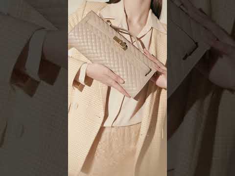 Jade Woven cluch leather bag with retractable handle closure and detachable and adjustable shoulder strap