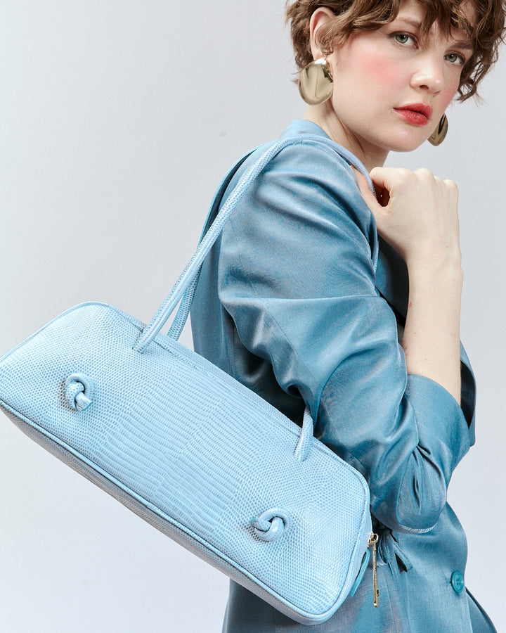 Grace Tejus – Elongated bag in glossy lizard-print calfskin
